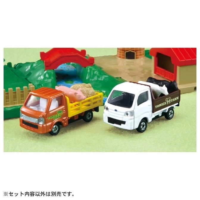  Tomica Farm toy trucks with farm animals on a play set.
