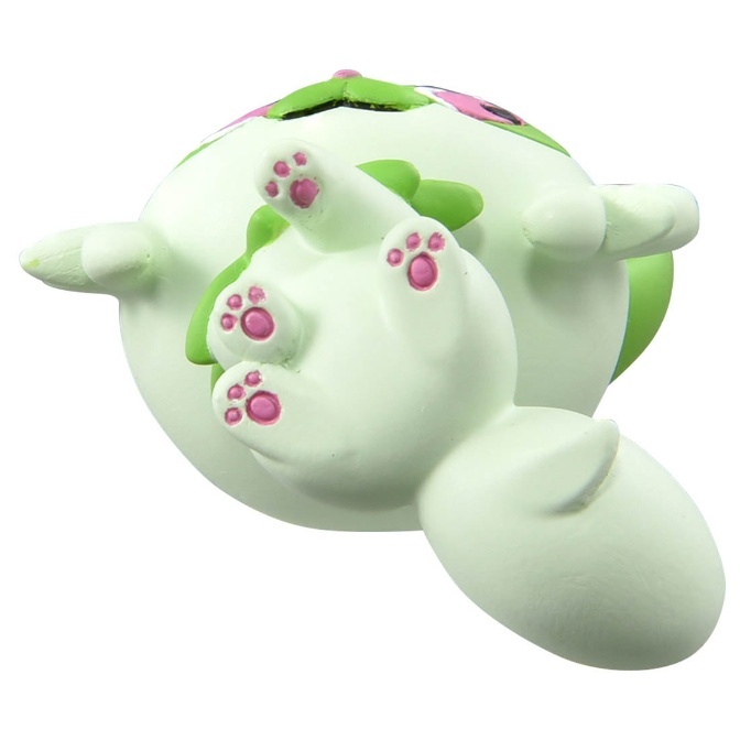 Shaymin Sky Forme plush toy lying on its back with pink paw prints visible.