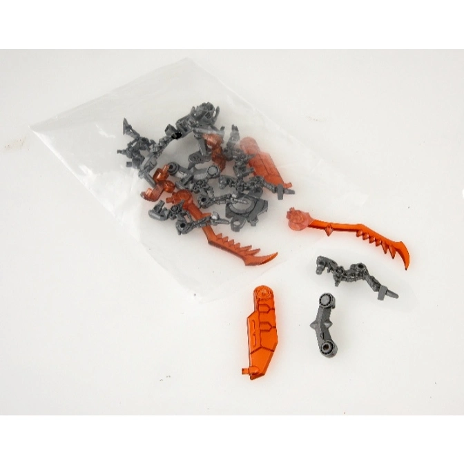  Bag of Bionicle parts, including orange blades and grey connectors.