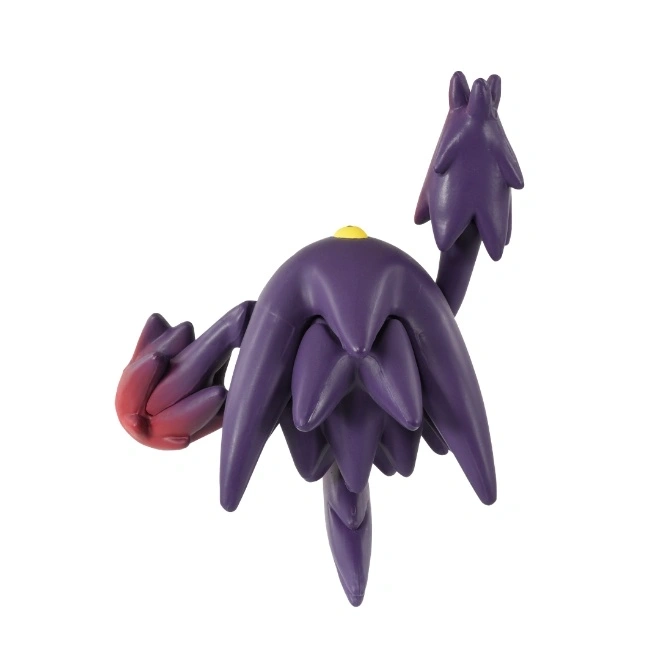  Purple Cacturne toy with red arm and yellow dot on top.