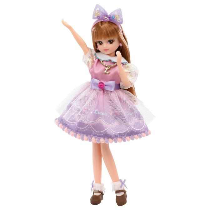  Licca doll in a purple dress and bow, arm raised.