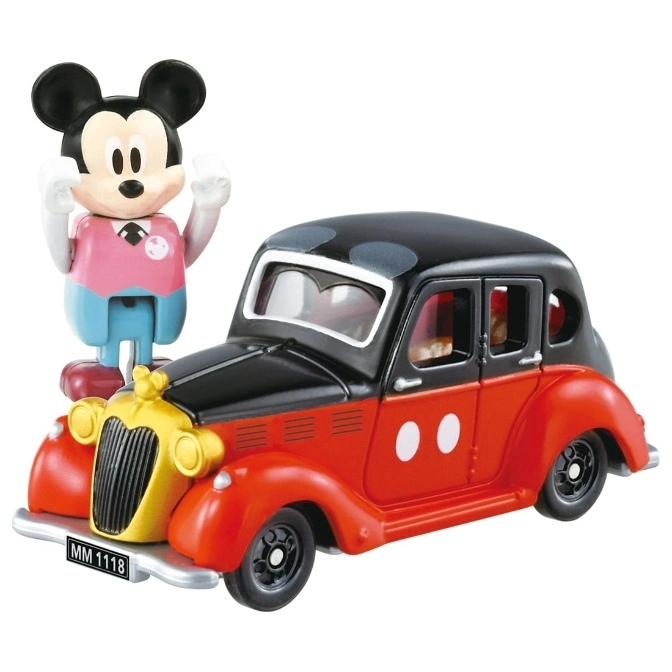 Mickey Mouse figurine standing next to a red and black vintage-style toy car.