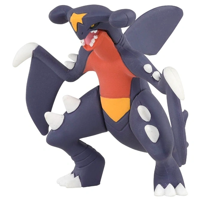 Garchomp toy figure with orange belly and white spikes.