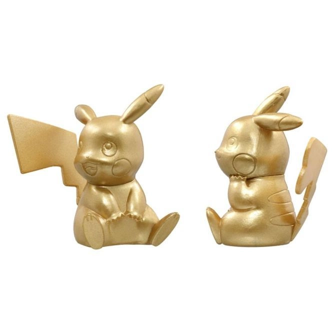  Two golden Pikachu figurines sitting. One faces forward, the other is turned to the side.
