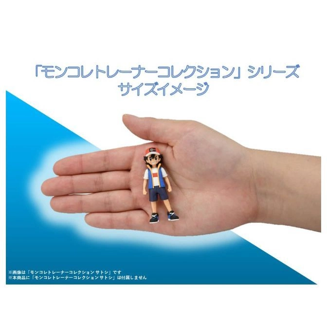  Ash Ketchum toy figure on a hand, showcasing its small size.