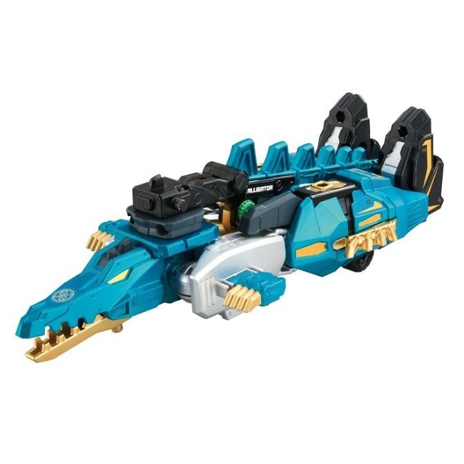 Teal alligator transforming toy with gold accents and a black cannon on top.