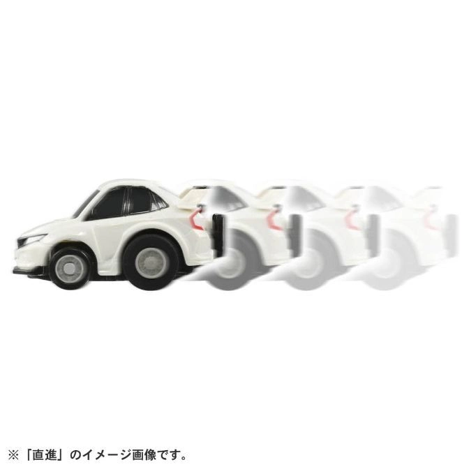  White toy car in motion blur, showing speed.
