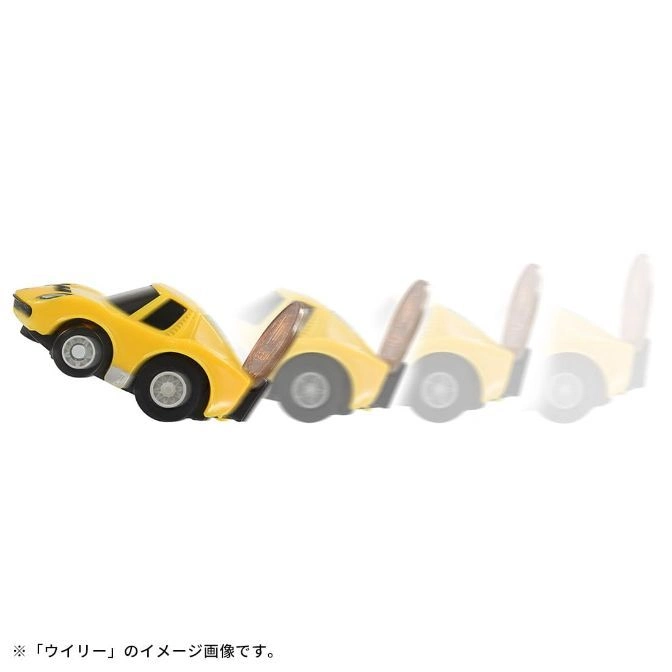  Yellow toy car doing a wheelie, motion blur shows movement.