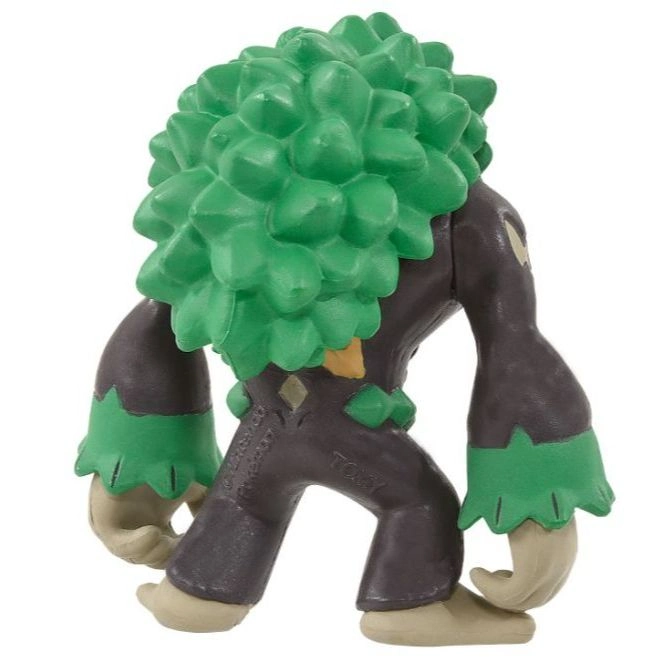 Trevenant Pokémon toy figure with green foliage on its head and arms, and brown body.