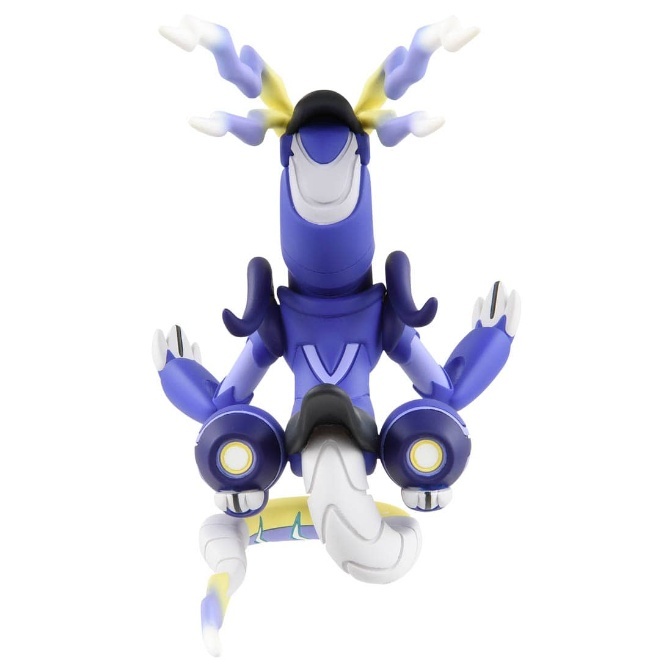 Blue and white toy robot with a snake-like tail and yellow accents.