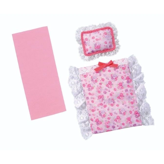  Doll bed set with floral pattern, lace trim, and pink blanket.