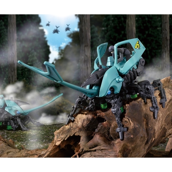  Teal beetle-shaped toy robot with a figure riding it, set in a forest scene with other robots flying in the background.
