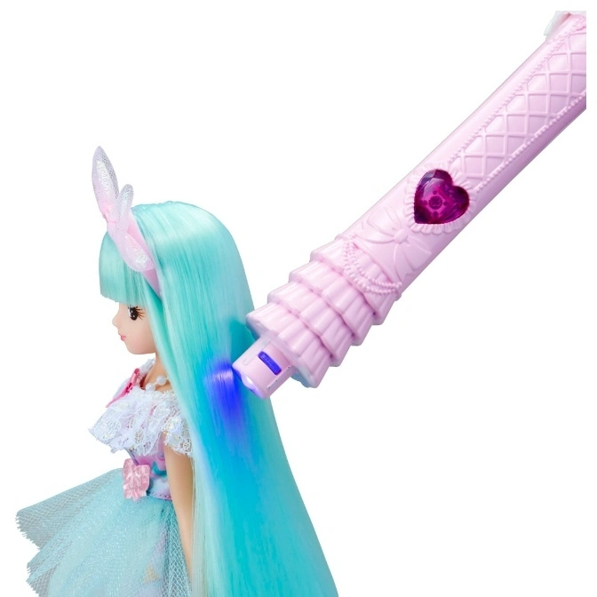  Doll with light-up hair being styled with a pink toy wand.