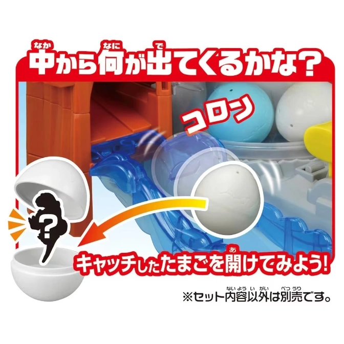  Toy egg catcher with capsules rolling down a blue track into a white eggshell.