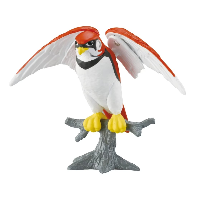 Toy bird with red and white plumage perched on a gray branch, wings spread.