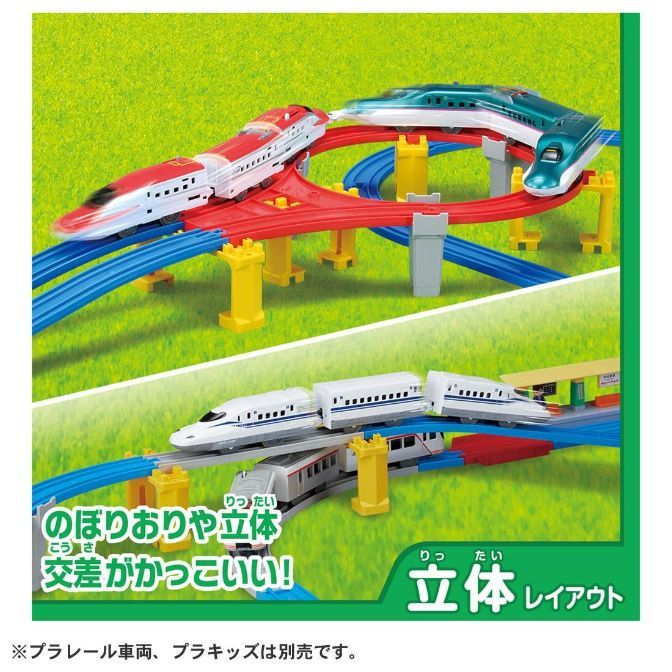  A toy train set with three bullet trains on a multi-level track.