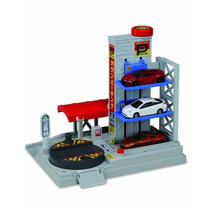 Toy parking garage with 3 levels, 3 toy cars, a rotating platform, and Japanese text.
