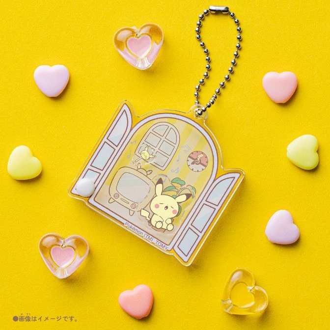 Pokémon keychain with sleeping Pikachu in a room, surrounded by heart candies.