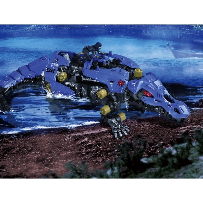 Blue crocodile Zoid toy with rider emerging from water. Features red eyes and yellow accents.