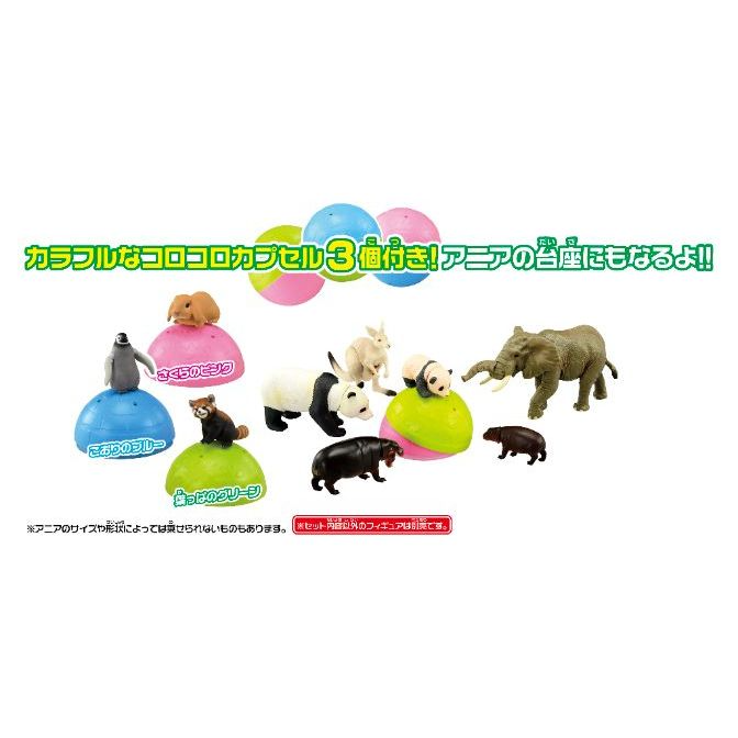  Toy animal figures on colorful capsule bases: penguin, panda, elephant, and more.