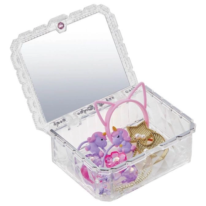  Open clear toy jewelry box with mirror, unicorn hair ties, cat ear headband, and gold dress.