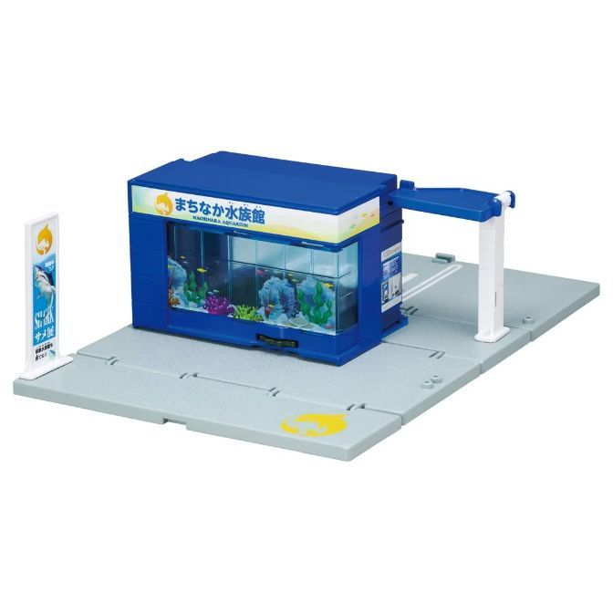  Toy aquarium building with parking, blue roof, fish tank display, and shark sign.