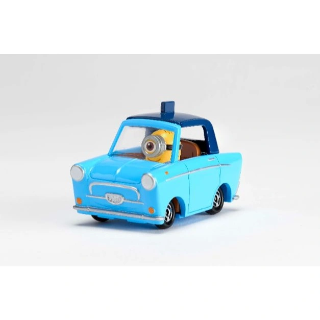 Blue toy car with a Minion driving. One-eyed Minion at the wheel.