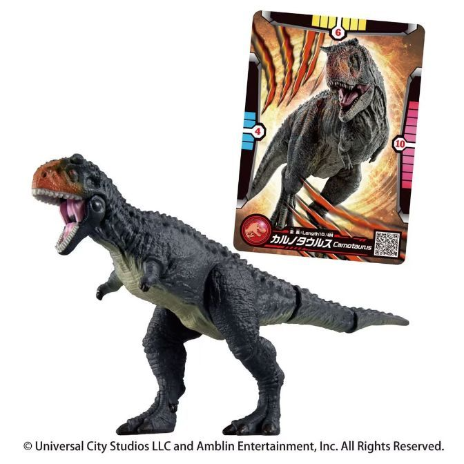 Grey Carnotaurus toy with an orange head, next to its trading card.