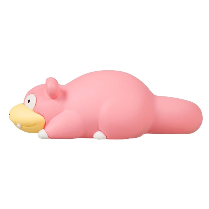  Pink Slowpoke toy lying down with a yellow snout and white feet.