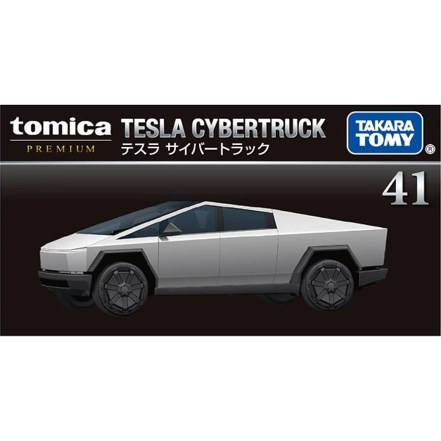  Tomica Tesla Cybertruck toy car, silver, with black wheels and a futuristic design.