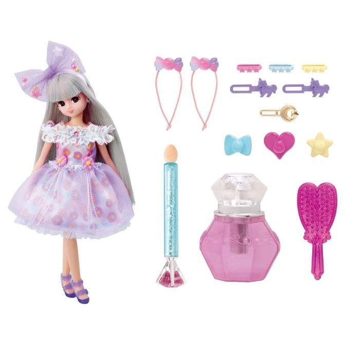 Doll with lavender dress, hair accessories, perfume bottle, and brush.