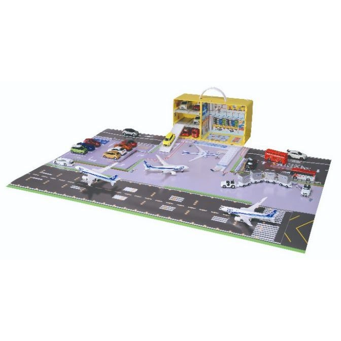 Toy airport playset with planes, cars, buses, and a parking garage.