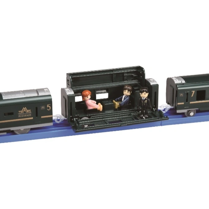  Toy train with figures inside an open carriage. The train is green and on a blue track.