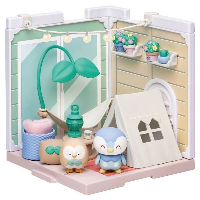 Pokémon diorama with Rowlet, Piplup, tent, hammock, and plants. A cute playset for Pokémon fans.