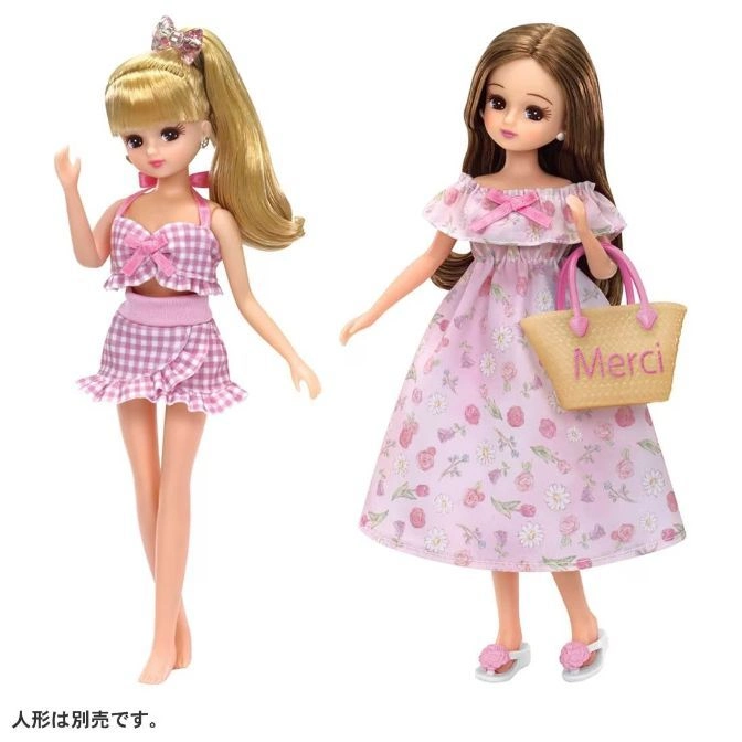 Two Licca dolls: one in pink gingham, the other in a floral dress with a "Merci" bag.