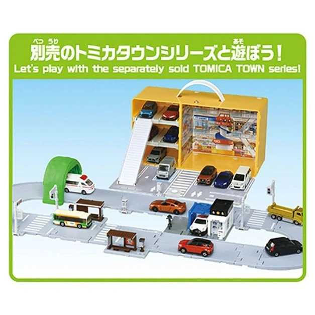  Tomica Town playset with cars, buildings, and road sections, encouraging imaginative play.