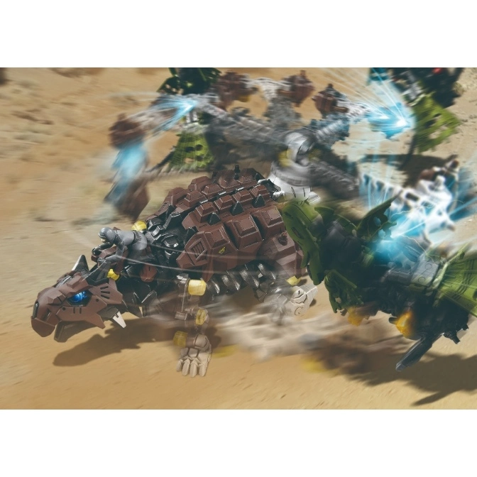  Brown Zoid toy with rider in desert battle, firing blue energy blasts.