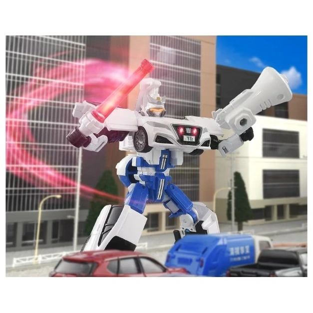  Transformer toy robot with car parts, holding a red light saber and megaphone, standing in a city.