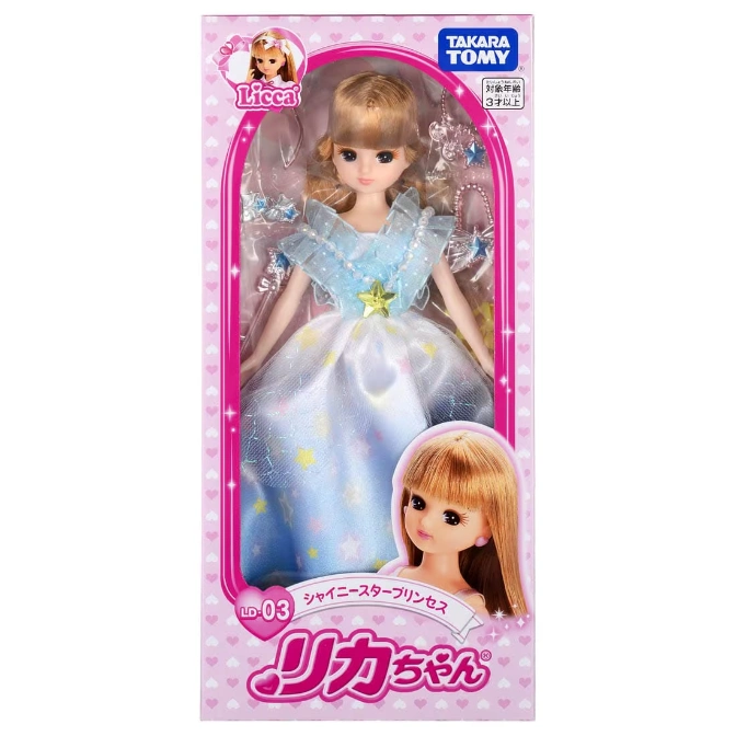  Licca doll in a blue star dress, packaged in a pink box with character images.