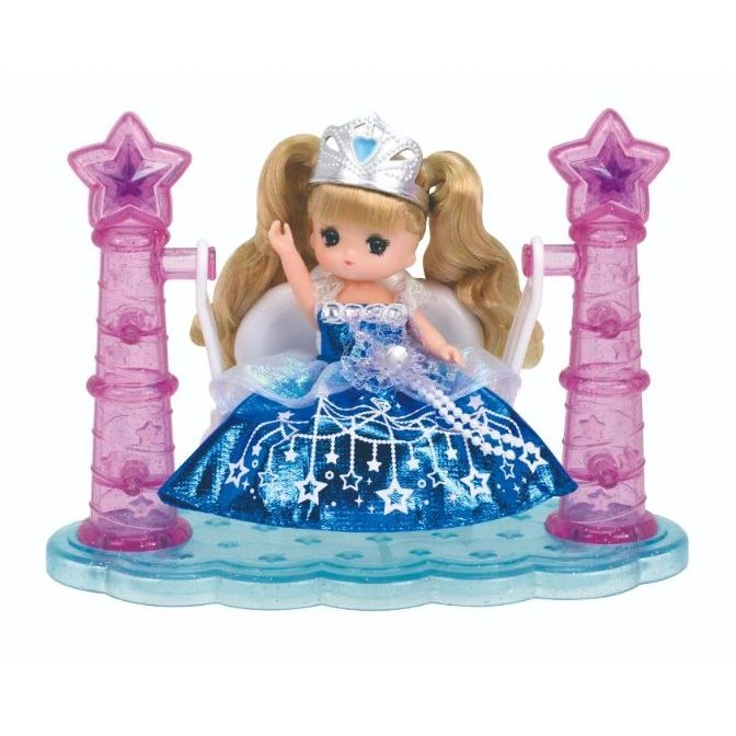  Licca-chan doll in blue dress with star details on a swing set with star-topped posts.