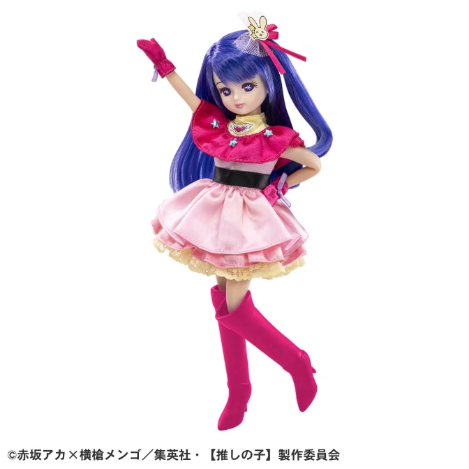 Doll with blue hair, pink dress, and boots, arm raised.