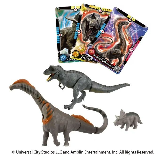 Dinosaur toys and cards: T-Rex, Triceratops, Titanosaurus. Gray plastic figures with trading cards.