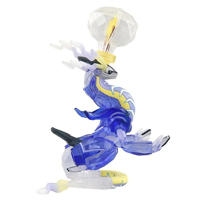  Crystal puzzle of a dragon with a lightbulb on its head. Blue, white, and yellow.