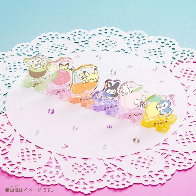  Pokémon fruit-themed memo stands on a doily, featuring Pikachu, Piplup, and others.