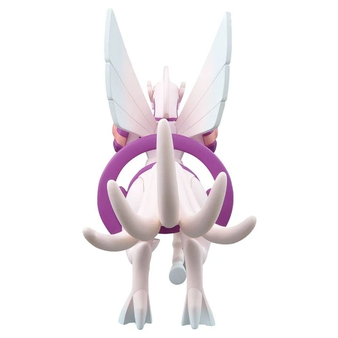  Arceus toy figure with purple hoop, wings, and tail tentacles, viewed from the back.