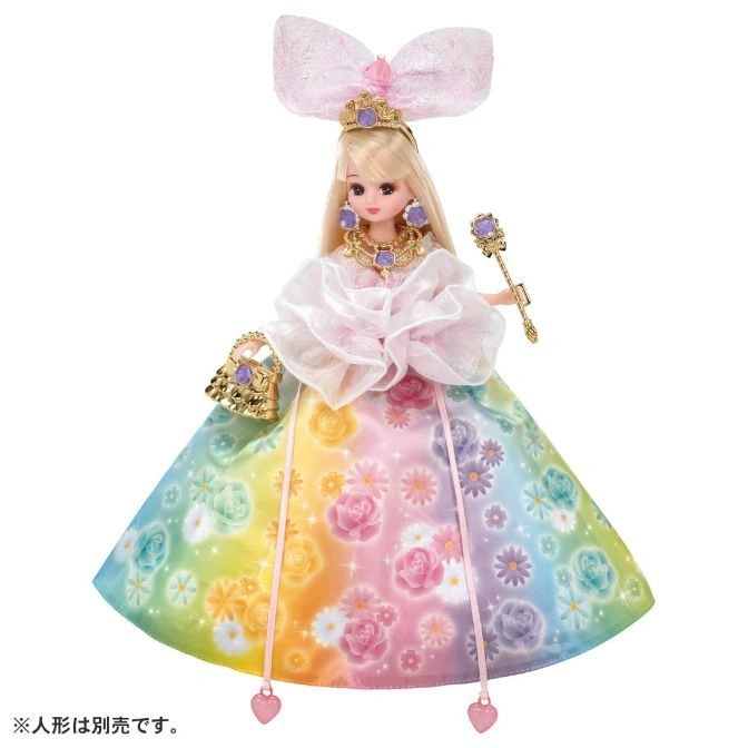 Licca-chan doll in rainbow floral gown, crown, bow, and accessories.
