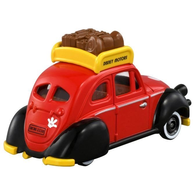  Red Disney Motors toy car with black fenders and a yellow roof rack holding brown luggage.