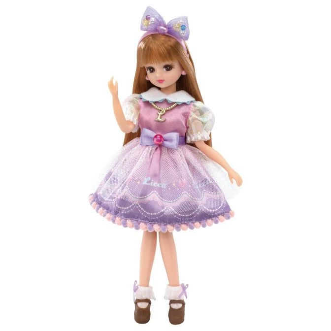  Licca doll with brown hair, wearing a purple dress, bow headband, and brown shoes.