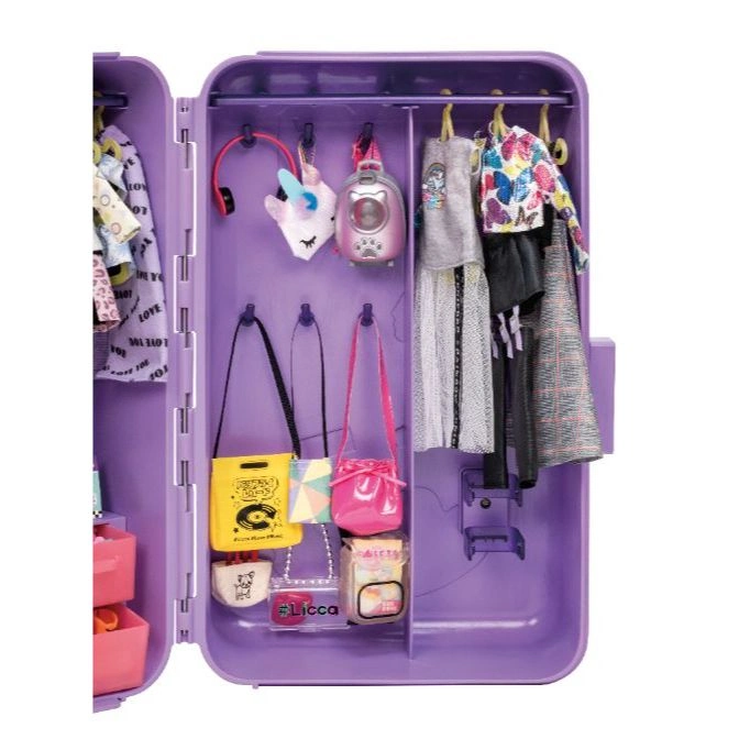  Purple doll wardrobe with clothes, bags, headphones, and accessories hanging inside.