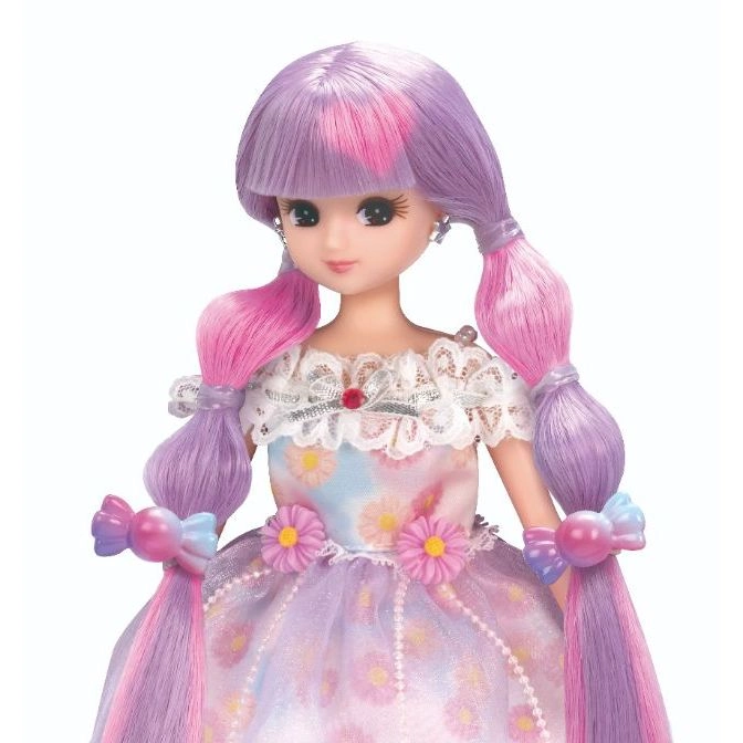  Doll with purple and pink hair in braids, wearing a floral dress with daisy accents.